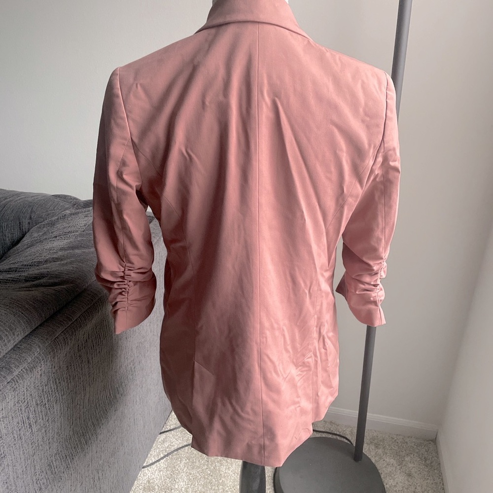 Blush colored blazer with quarter length sleeves
